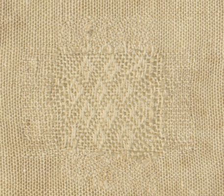 Detail of white diaper pattern.