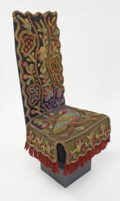 Three-quarters view of chair cover on form.