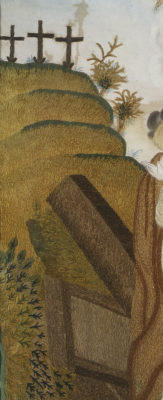 Detail of embroidered landscape with three crosses.