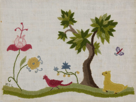 Crewel embroidered image featuring a bird, a deer, a tree, a butterfly, and two large flowers.